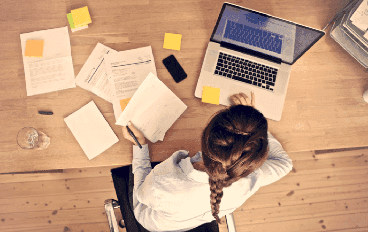 Bird-eye-view-of-woman-at-desk